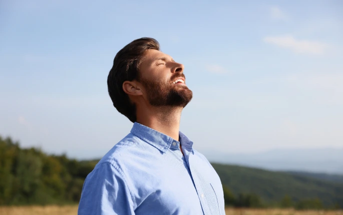 A man breathing freely.