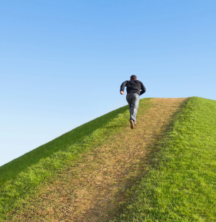 A man running uphill.