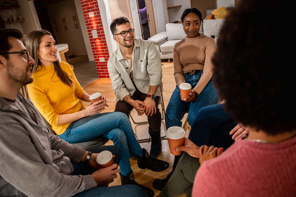 Diverse Group In A Support Circle At Sober Living Homes In Los Angeles.